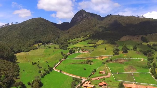 High mountains of mythical figures, trees and a clear sky all in Tabio