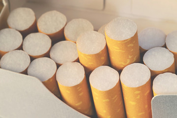 peel it off Cigarette pack prepare smoking. Packing line up.  photo filters Natural light.