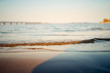 Water and sand against the blue sky