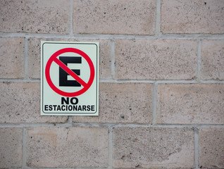 No parking sing in wall. Parking concept