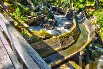 An old wooden floating chute at Swedish river rapids