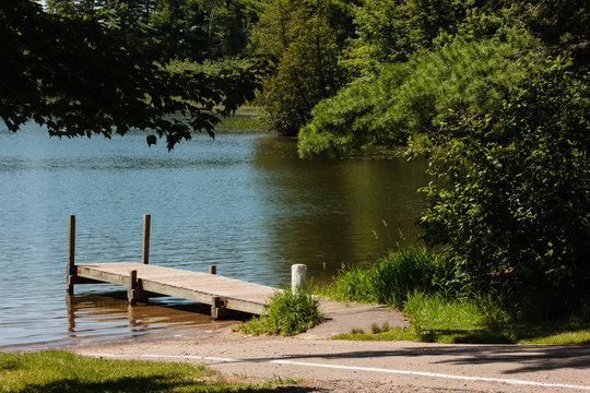 The Pier And Boat Launch At Star Lake, Near Star Lake, Wisconsin In Vilas County, Awaits The Boater In Late June.