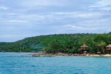 Obraz premium The beautiful tropical beach of Koh Rong, the paradise island with a nice bungalow, forest, coast, and white sand. Koh Rong island is a popular tourist destination in Sihanoukville, Cambodia