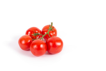 Fresh tomatoes on branch isolated on white. Branch of delicious five tomatoes on the left. Stock photo, side view. Ingredients for cooking. Healthy food, vegetables, vegetarian culture.