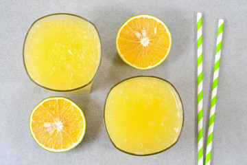 Sweet lime juice in glass cups with sweet lime fruits in the background