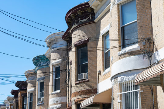 Row Of Old Brownstone Townhouses In Astoria Queens New York