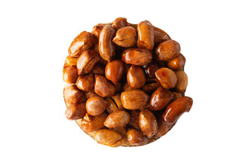 Tasty eastern sweets kozinaki made from peanuts and honey on a white background. Isolated.