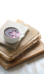 cup of tea, flower and books. romantic composition, relax tea time. 