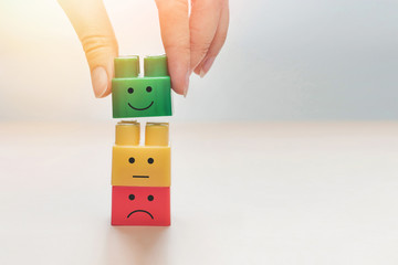 Conceptual image of the designer with a smile. The choice of the positive emotions and physical health