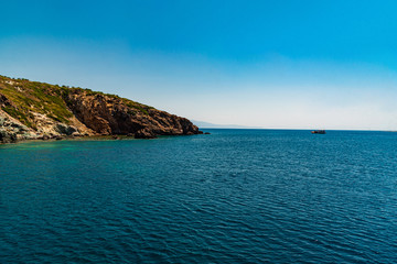 Naklejka premium View of the rocky shore from the ship