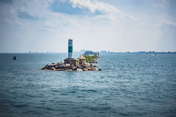 A pier off the coast of Chicago, Illinois in the middle of Lake Michigan on a summer day.