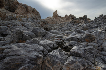Rock stones beach near village of Mezapos, Mani, Laconia, Peloponnese, Greece