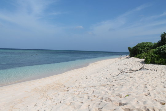 tropical beach with blue sky in tomia island wakatobi 