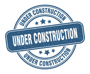 under construction stamp. under construction label. round grunge sign