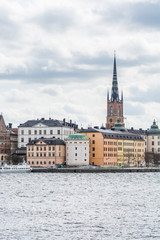 Fototapeta premium Clock tower of Riddarholm Church, the church of a former medieval abbey in Stockholm, Sweden. The church serves as the final resting place of most Swedish monarchs