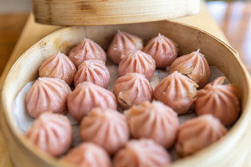 steam basket with pink dim sum