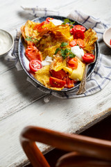 Delicious crepes with salmon and cream on plate