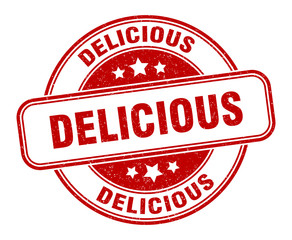 delicious stamp. delicious round grunge sign. label