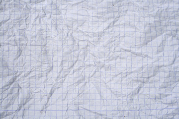 crumpled white graph paper