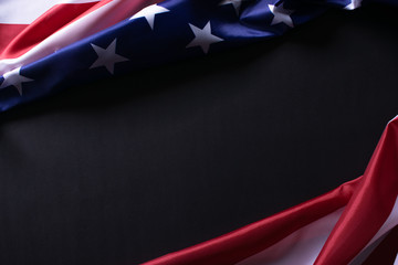 Happy Memorial Day or Independence Day.  American flags against a black paper background.