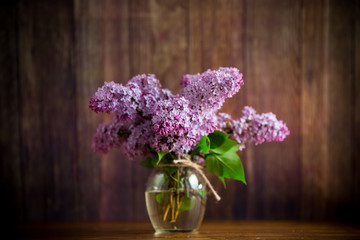 bouquet of beautiful spring flowers of lilac on the table