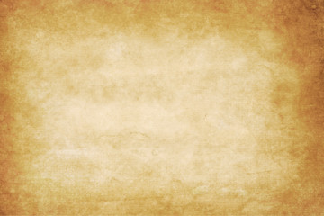 old dirty kraft paper texture or background with dark vignette borders