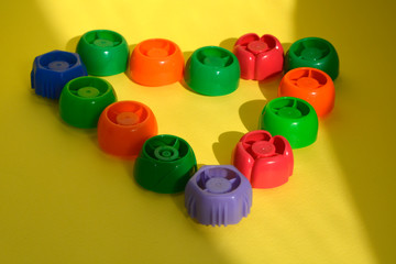 multi-colored plastic corks from baby food, zero life-style waste, recycling garbage