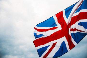 British UK flag blown in the wind against sky