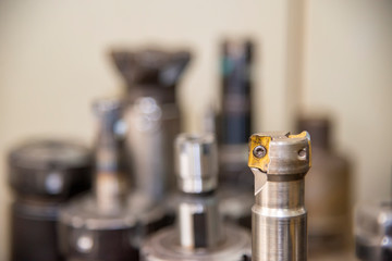 The used indexable tools after cutting on the CNC milling machine. The tooling system for machining canter. © Pixel_B