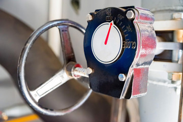 Close up black valves plug with temperature indicator
