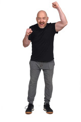 man with sportswear with fist raised on white background