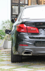 Fototapeta premium Back side of a black luxury car.