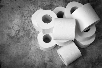 Soft toilet boom yeah rolls for hygiene personnel on a gray background. Stock of basic hygiene products in case of spread of coronavirus, bacteria or germs