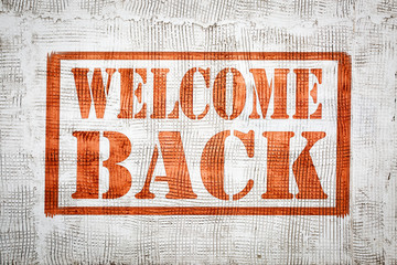 welcome back graffiti sign on wall