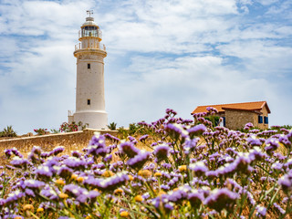 Pathos. Cyprus. White lighthouse on the background of the sky. Lighthouse on the Mediterranean Sea....