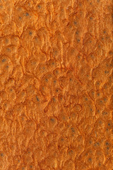 Bronze coated hammered metal texture, macro detail 