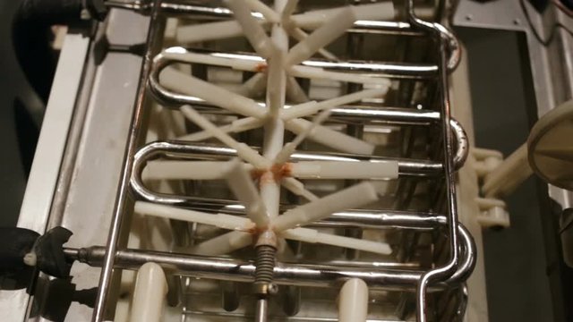 automatic ice-making plant close-up. The empty hopper is closed. Plastic agitator rotates
