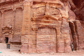 Tomb entry and carved sandstone facade in Petra, Jordan