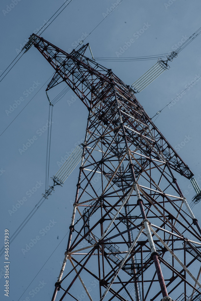 Wall mural .electric transmission lines against the sky bottom view