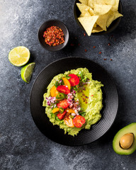 Guacamole is a Traditional Mexican Sauce with Nachos.Vegetarian dish.