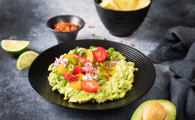 Guacamole is a Traditional Mexican Sauce with Nachos.Vegetarian dish.