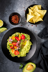 Guacamole is a Traditional Mexican Sauce with Nachos.Vegetarian dish.