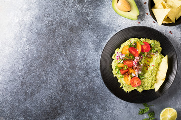 Guacamole is a Traditional Mexican Sauce with Nachos.Vegetarian dish.