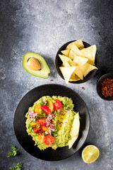 Guacamole is a Traditional Mexican Sauce with Nachos.Vegetarian dish.