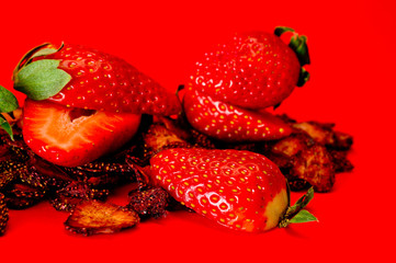 Chips from dried strawberries, sliced into thin slices. Background for healthy eating and vegetarianism. Snacks