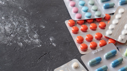 Text space of pills on dark background. Stop pandemic concept