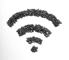 Wi-Fi symbol folded from roasted coffee beans on the basis of burlap. Wifi sign made of roasted...