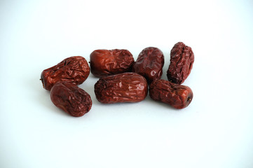 ripe dried jujube fruits on a white background. space for text and advertising