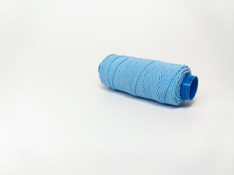 One reel of thread on white background, top view.