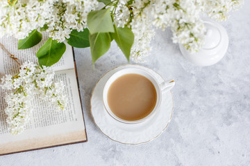 old book branch of white lilac. Greeting card good morning